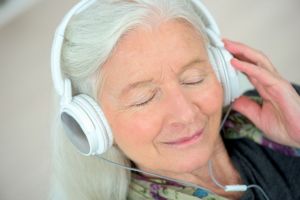 A woman listens to music. 