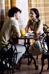 Couple Enjoying Conversation in Café
