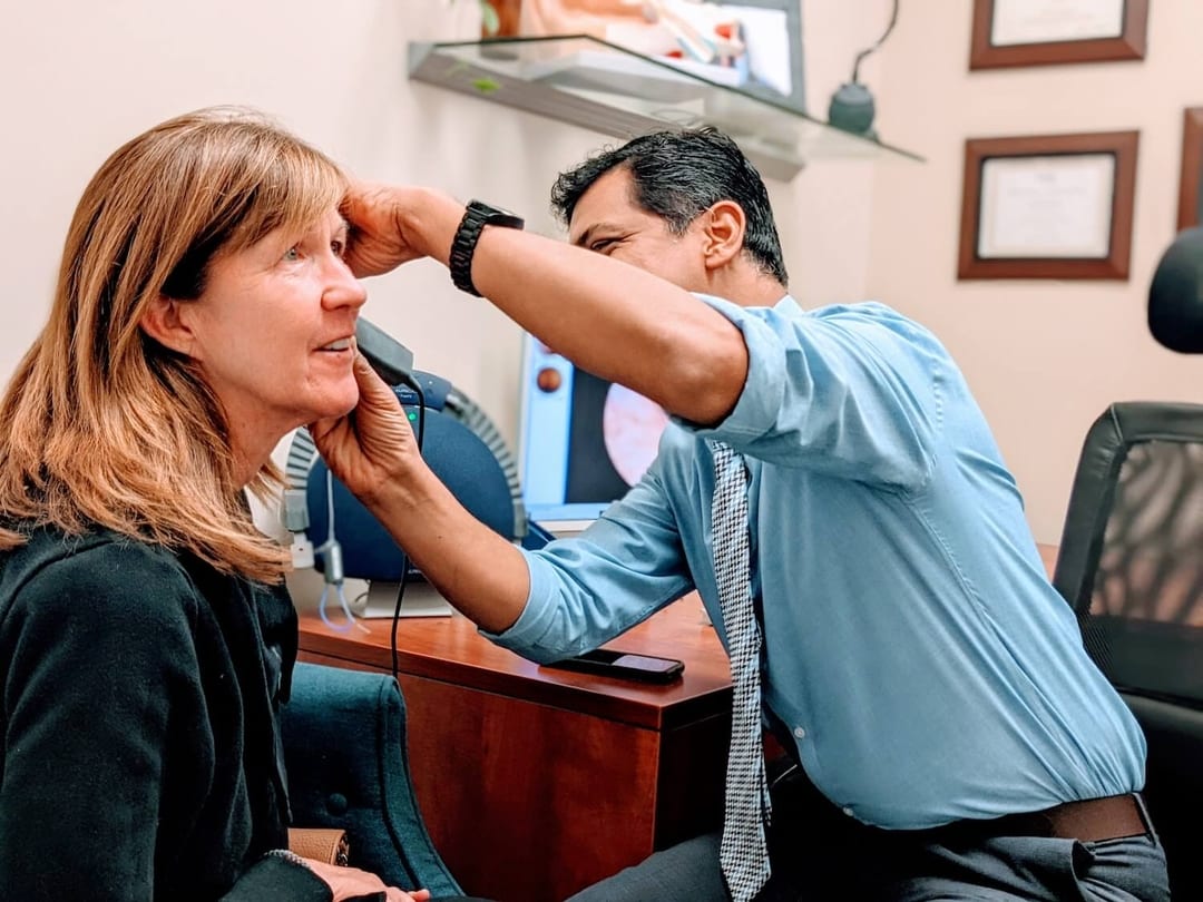 Dr. Gosu performing video otoscope exam