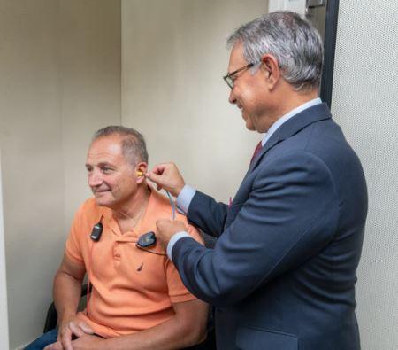 Dr. Biondi performing a hearing test