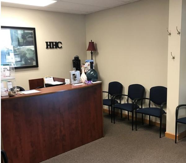 Waiting room and front desk at Hearing Healthcare Centers of Iowa in Atlantic, IA