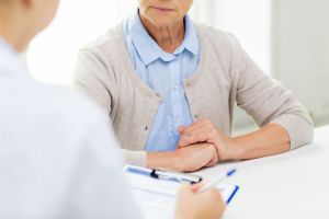 Senior woman talking to a healthcare professional