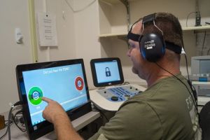 A veteran takes a hearing test via video.