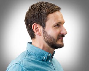 A man with bone-anchored hearing aid.