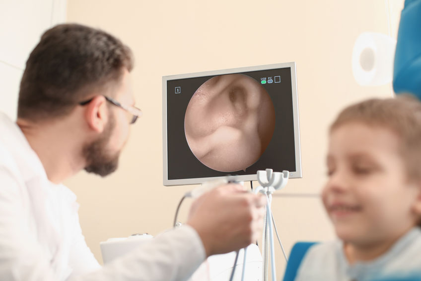 A boy gets an ear exam