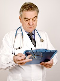 Physician looking at a clipboard