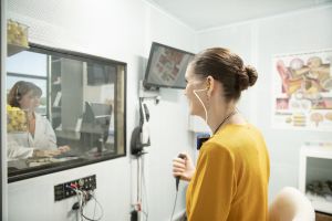 A woman gets a hearing test.