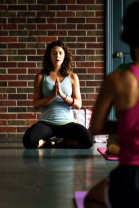 A woman practices yoga.